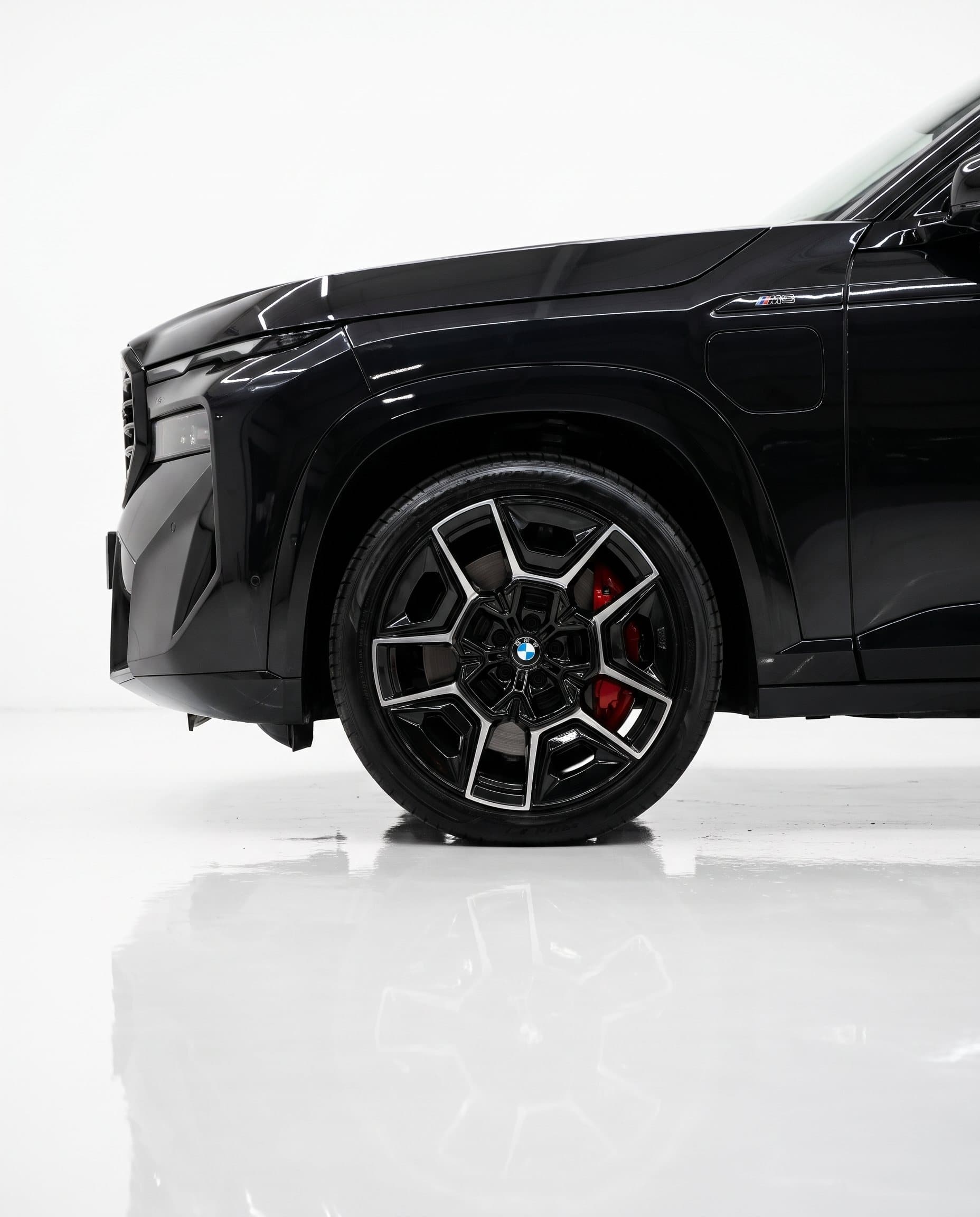 Wheel and brake detail of the BMW XM in the studio
